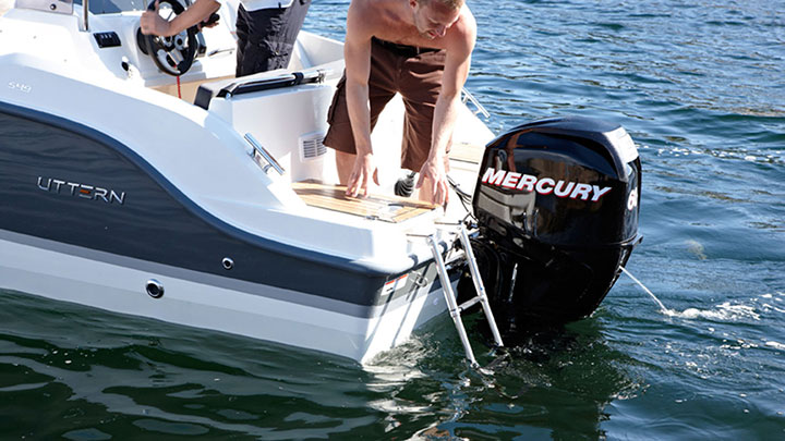 60 EFI Mercury Marine Outboard Motor powering motorboat, sea water is cooling engine 